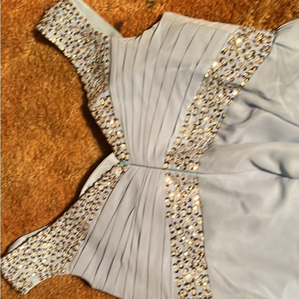 Elegant Light Blue Dress with Gold Accents